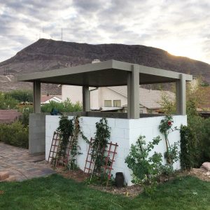 Enclosed gazebo area with white brick walls