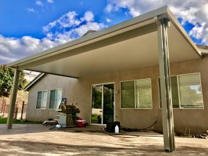 Custom patio cover attached to a small home patio