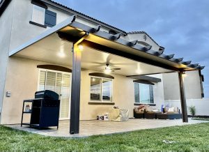 Upward angle of a small patio cover with custom lighting and colors