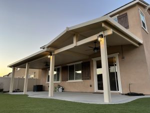 Patio cover of two-story house in backyard