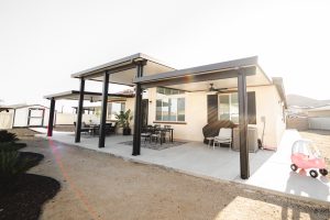 Custom patio cover with 3 different tops, the middle one being the tallest height